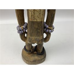 Early 20th century West African Yoruba family wooden figure of Orisha Oko, the god of farming/agriculture, carved from the solid, bears manuscript label of provenance verso H26.5cm