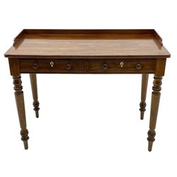 Victorian mahogany writing table, the rectangular top with raised gallery back, fitted with two drawers, on turned supports