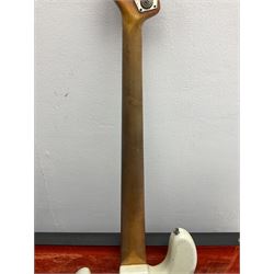1963 Fender Jazz three-knob bass guitar; impressed with date code 7AUG63A on end of neck and serial no.L08587 on back plate; all original but re-finished in white in the 1970s; sold with photographs of the instrument in the 1960s with original finish and in the 1970s re-finished; L117.5cm; in original hard carrying case; Provenance: the professional guitar of Howard Livett from new to his death in 2005. Howard played in The Humperdincks, the backing group for Englebert Humperdinck, also played in the backing group for Max Bygraves and in the band Hedgehoppers Anonymous. The guitar is also sold with a manuscript letter of provenance from Howard's wife.