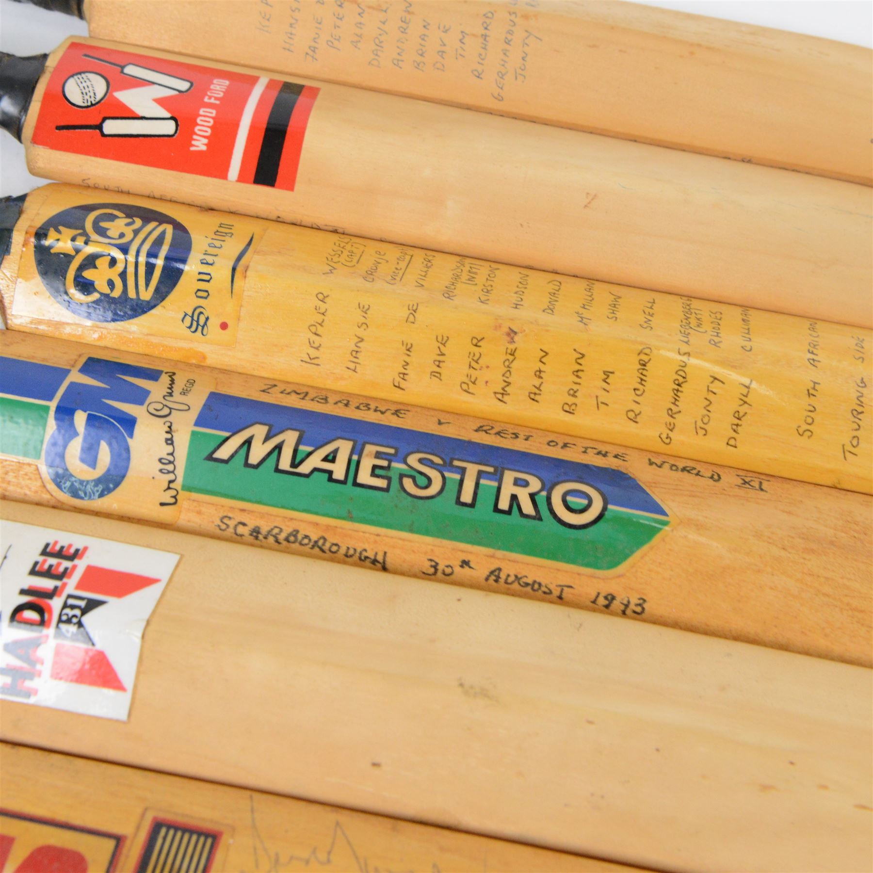 Signed International cricket memorabilia, comprising Alan Donald signed Kookaburra Commander cricket ball, wide brimmed hat signed by Darren Sammy and other West Indies players and a collection of signed miniature cricket bats, each with signatures of International cricket players including Brian Lara, Grant Flower, Richard Hadlee, Zimbabwe vs Rest of World 1993, South Africa vs Presidents VI 1994, Eastern Province South Africa 1992 and South Africa Touring Side Scarborough 1994