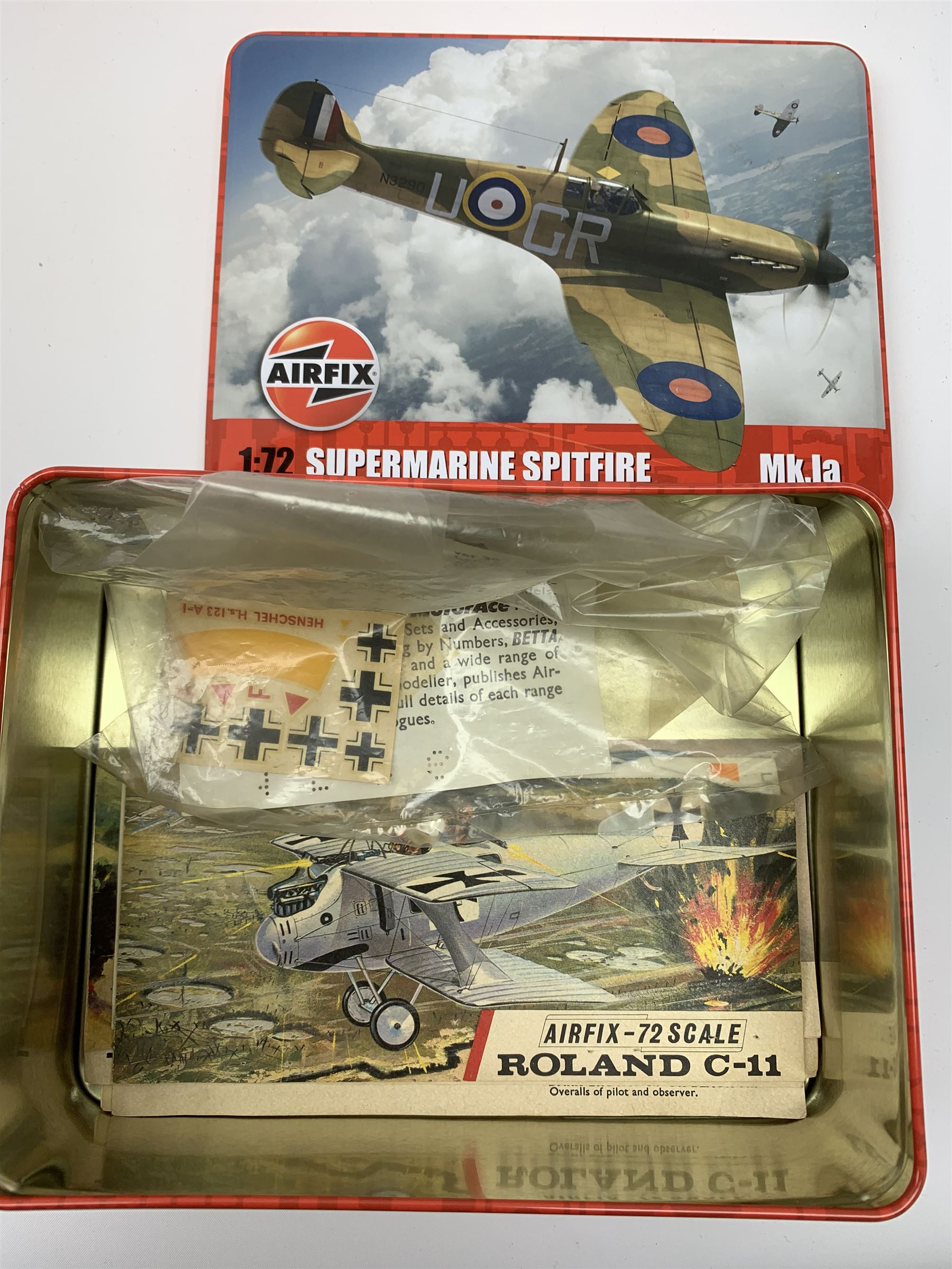 Seven plastic model construction kits - Airfix Vodaphone McLaren Mercedes racing car and Jaguar 'E' Type, Revell Ferrari F310B racing car and four tanks by Airfix, Revell and Tamiya; all boxed in factory sealed transparent packaging; together with an Airfix Spitfire kit tin, various model instruction sheets, catalogues and magazines.