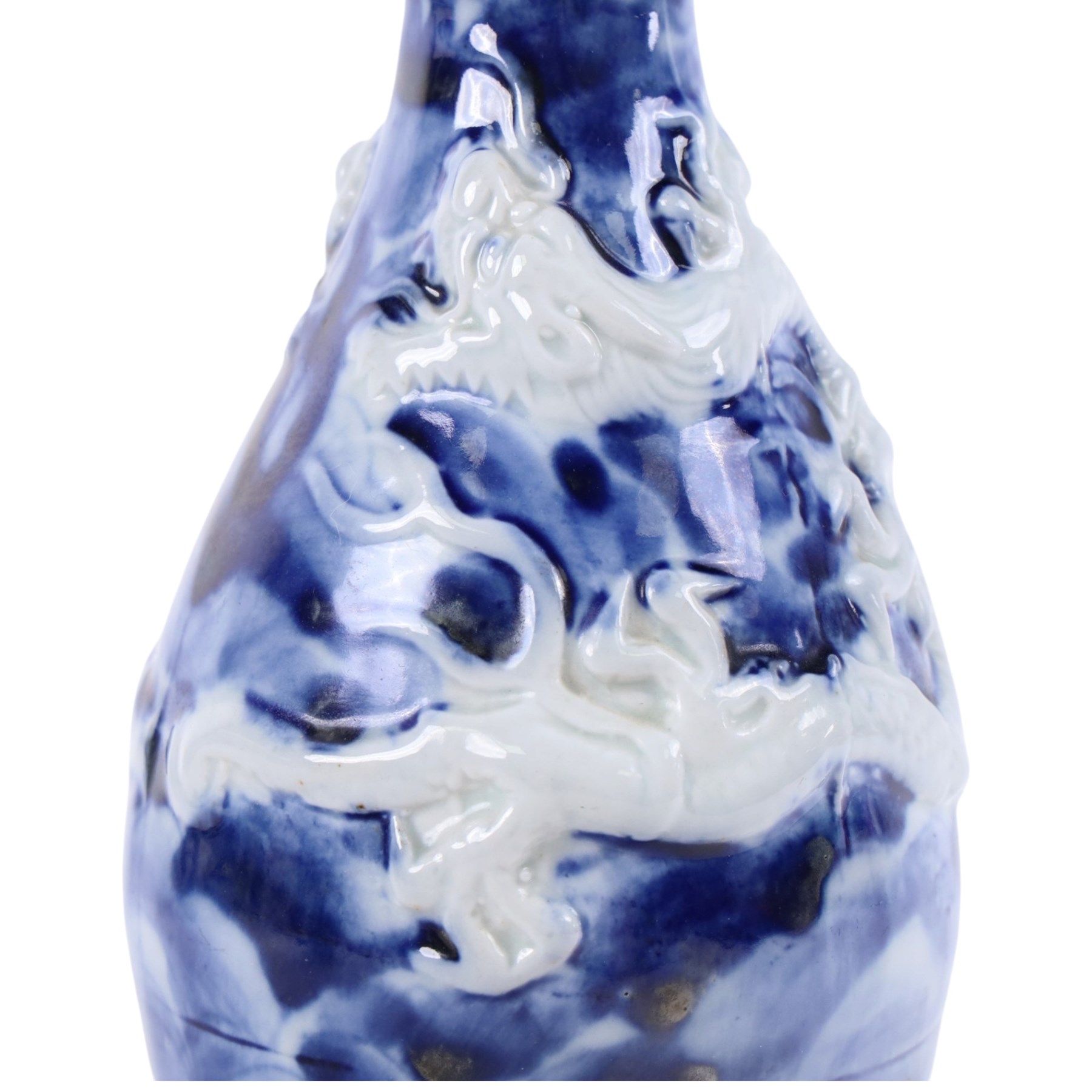 Pair of blue and white moulded vases, decorated with dragons amongst clouds, together with two blue and white planters painted, the first decorated with pagodas within a landscape scene, the other with musicians, vases H26cm 