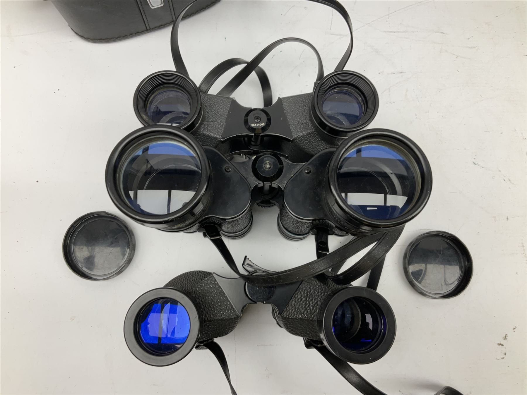 Eleven cased pairs of binoculars, to include Omiya 8x30, Tasco, Esde-Optik 8x40 Weitwinkel, Chinon 10x50 Field. Aico Rapide 8x30, Astralite zoom 6x- 14x32, etc