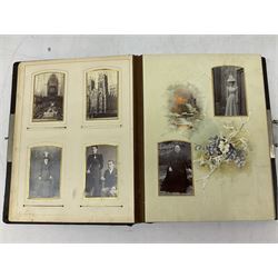 Victorian leather bound photo album, the interior leaves containing apertures of various sizes and shapes of portraits surrounded by printed floral designs, H28cm