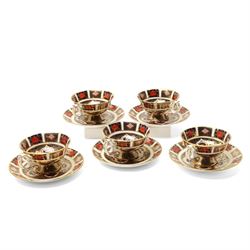 Set of five Royal Crown Derby pattern 1128 teacups and saucers