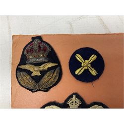 Quantity of WW1 and later Royal Navy and RAF cloth and metal badges and insignia