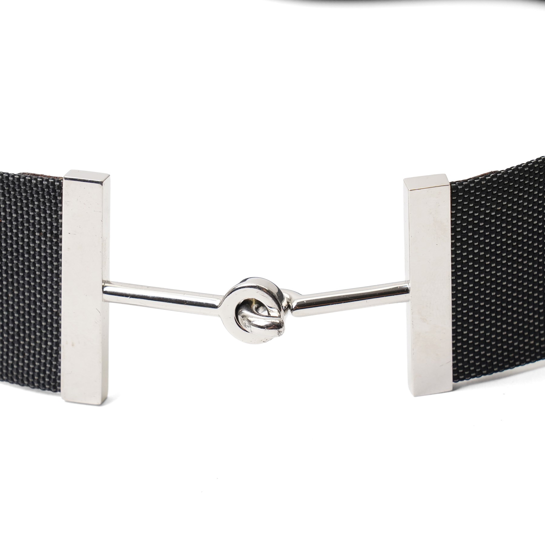 Hermès - black woven canvas and leather belt, with palladium-plated hardware and leather tab stamped Hermès Paris Made in France, size 42, with dust bag