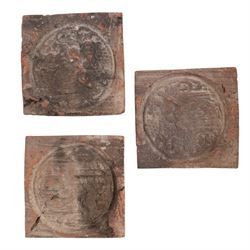 Three medieval tiles, decorated in relief, H10cm