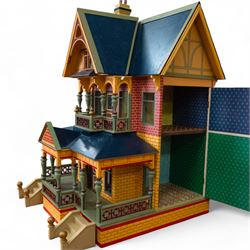 Moritz Gottschalk three storey wooden dolls house model 3589, with two side openings, with blue roof, painted exterior and wallpapered and painted interior, similar example featured in 'The Genius of Moritz Gottschalk' book, page 57, including chimney H100cm