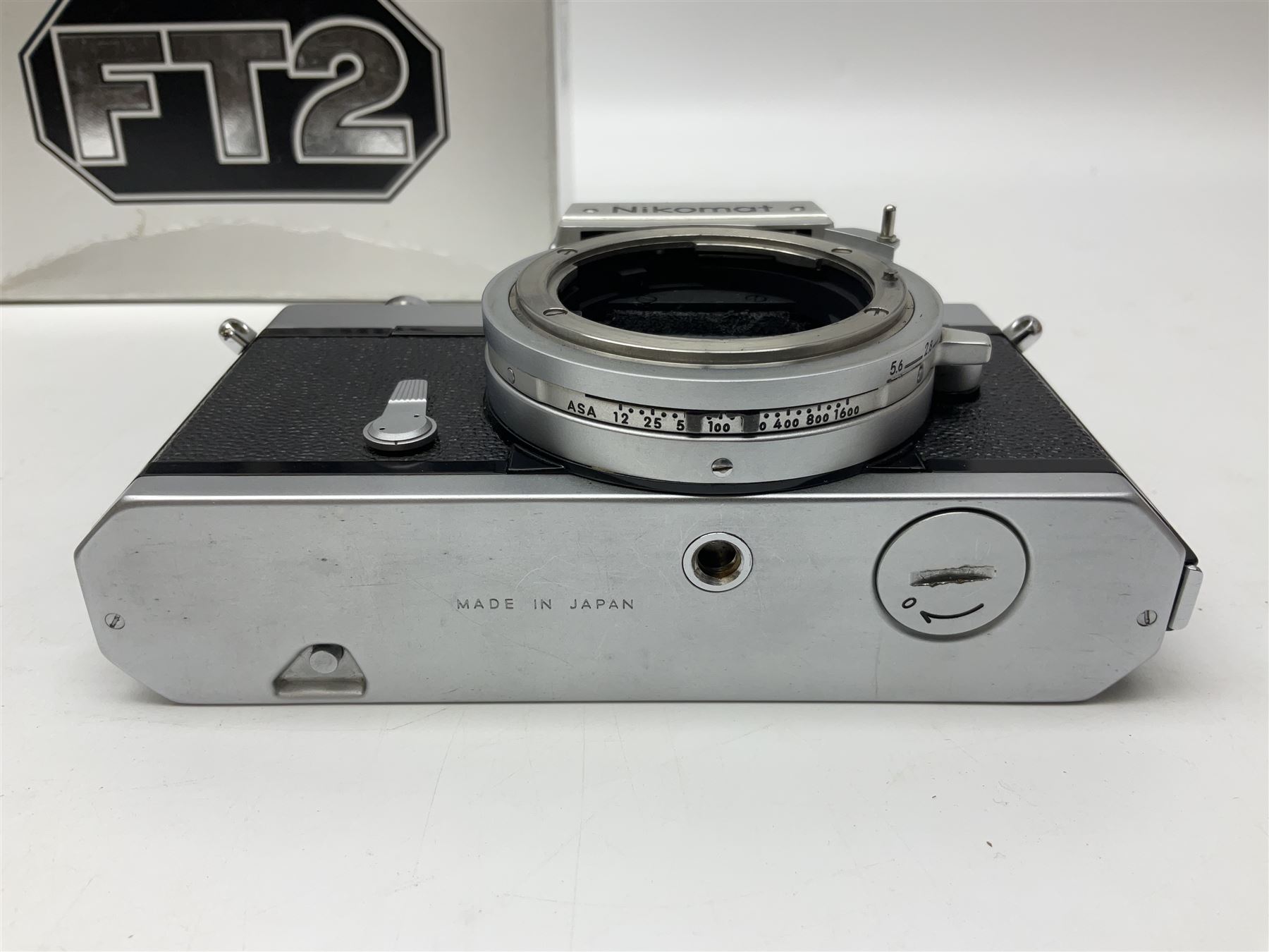 Nikkormat FT2 camera body, serial no. 5066813, in original packaging, together with Nikkormat EL camera body, serial no. 5577358, with Nikon Nikkor 50mm 1:1.8' lens no. 2143575, Nikkormat FT, serial no. 3968385, and Nikomat FT camera body, serial no. 4015491