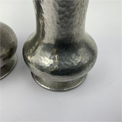 Pair of Liberty & Co Tudric pewter vases, each of bellied form with hammered finish, upon a circular spreading foot, impressed beneath 0987, H12cm