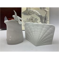 Lladro Collectors Society items, comprising of The Will to Create book, two candle holders; Sailing the Sea no 17665, Dolphins at Play no 17666, Plaque Bringing Us Together, key fob, leather wallet and a members joining pack with plaque, all in original boxes  