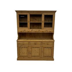 Waxed pine dresser, glazed doors with five spice drawers, above three drawers and three cupboards
