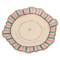 Late 19th century tea service, decorated with a green and pink strips, with internal decoration of budding branch within a gilt band upon a white glazed ground, comprising  twin handle lidded sucrier, milk jug, three serving plates, nine cups and saucers and four teacups