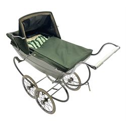 Silver Cross coach-built doll's pram with green fold-down hood and cover, sprung tubular frame, chrome and white handle, four spoked wheels with brake, mattress, pillow and bedding L97cm