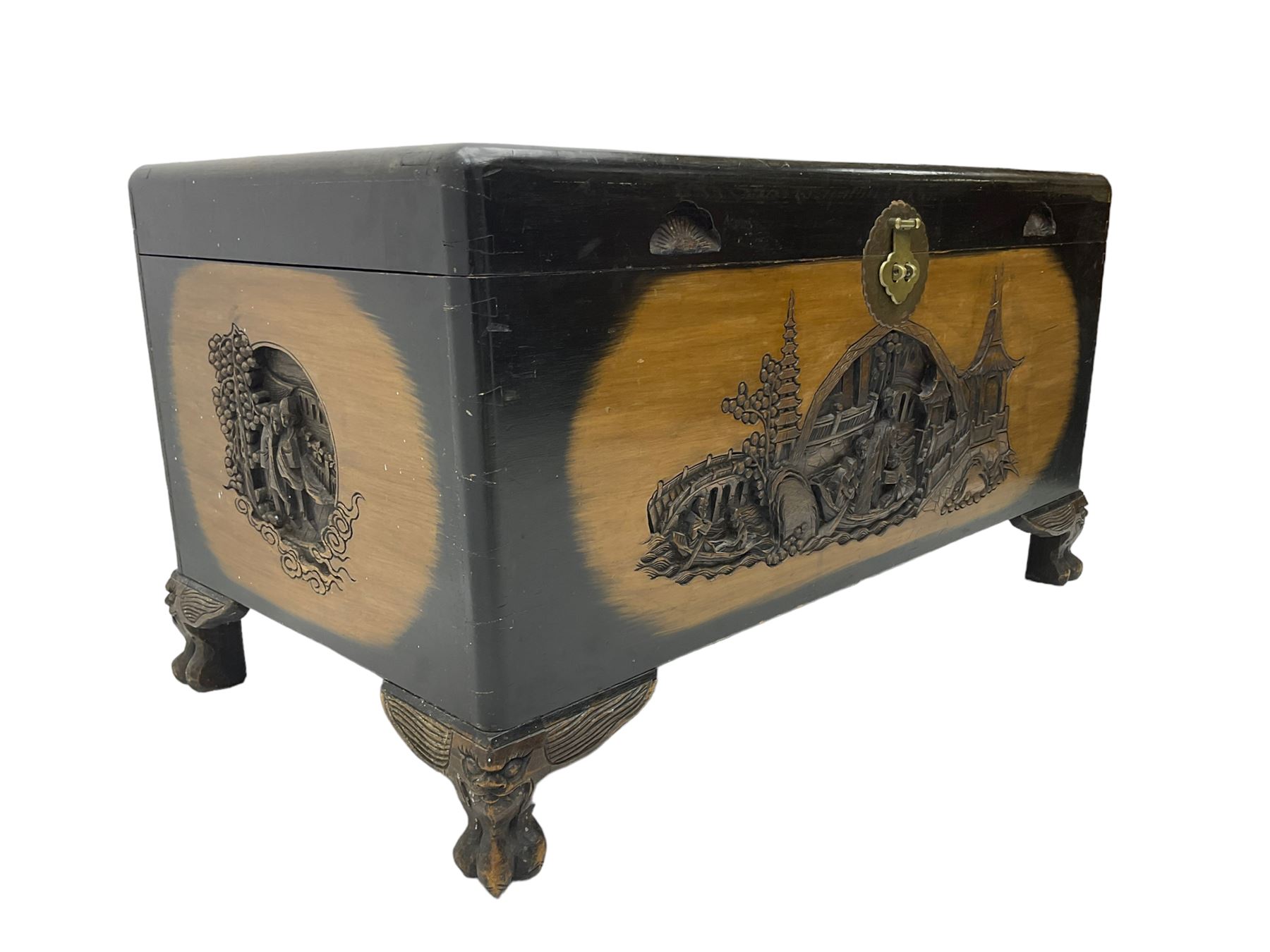 Singapore camphor wood blanket chest, rectangular hinged top with carved panel depicting traditional pagoda and river scenes