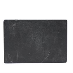 19th-century Italian Grand Tour micromosaic paperweight, the rectangular slab of polished Nero Belgio black marble inset with an oval micromosaic panel finely composed in minute tesserae, depicting a classical architectural view evocative of ancient Rome, centred by a triumphal column and flanked by monumental buildings, 14cm x 9.5cm