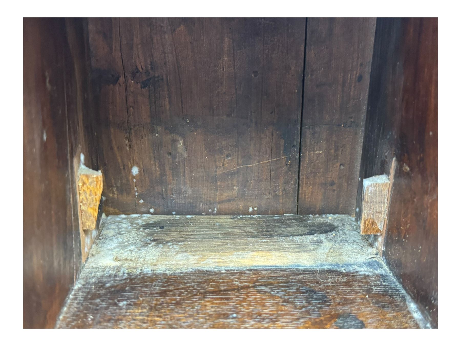 George III oak bureau, sloped fall-front enclosing a fitted interior with pigeonholes, small drawers, and a central compartment, over two short and two long drawers, brass escutcheons and drop handles, raised on bun feet