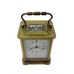 Two French early 20th century timepiece carriage clocks and a traveling case, both clocks with enamel dials, Roman numerals and steel hands, both with cylinder platform escapements.