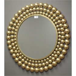  Gilt framed circular wall mirror, frame decorated with graduating balls, W69cm  