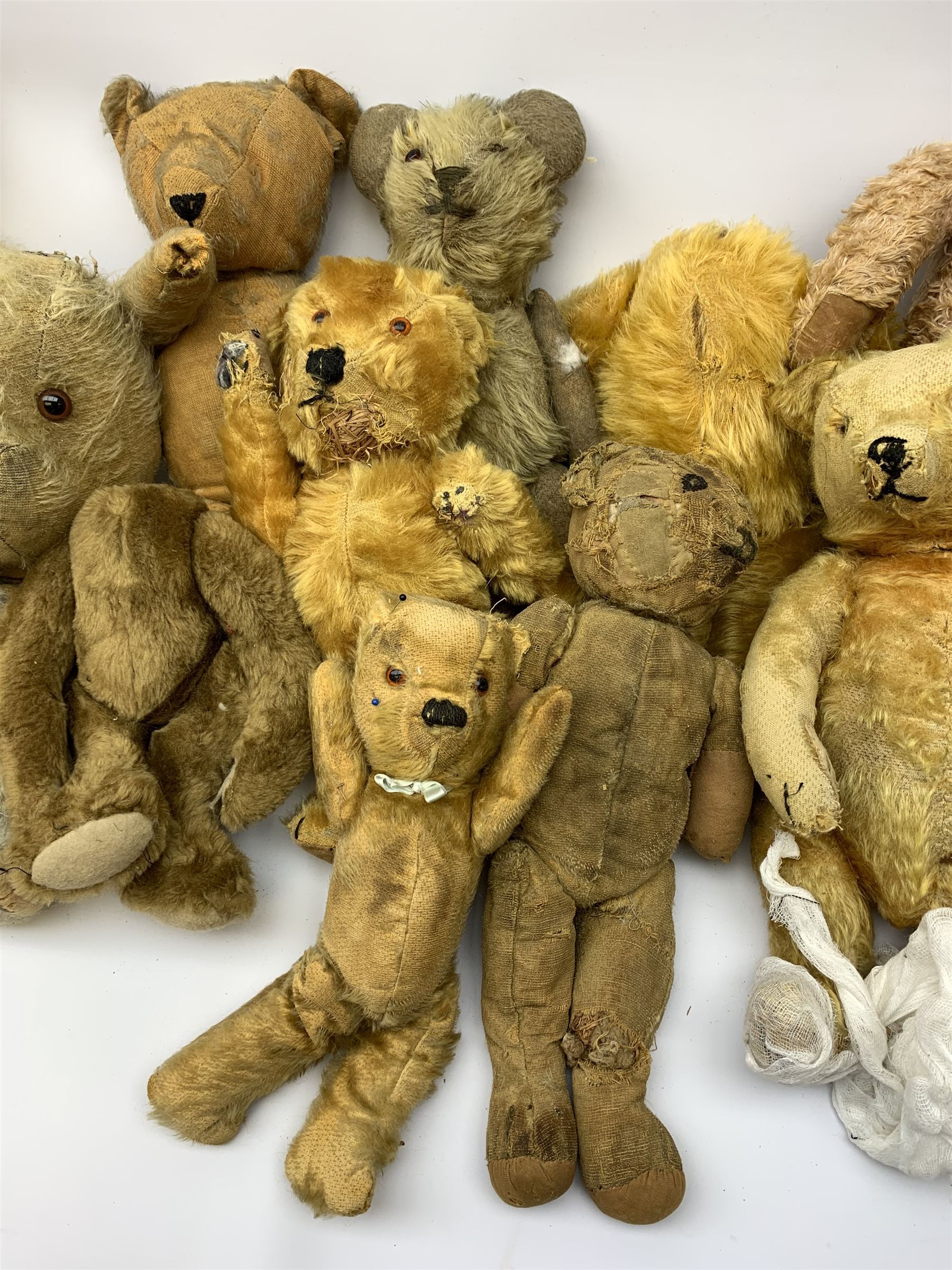 Quantity of early wood wool filled teddy bears for restoration.