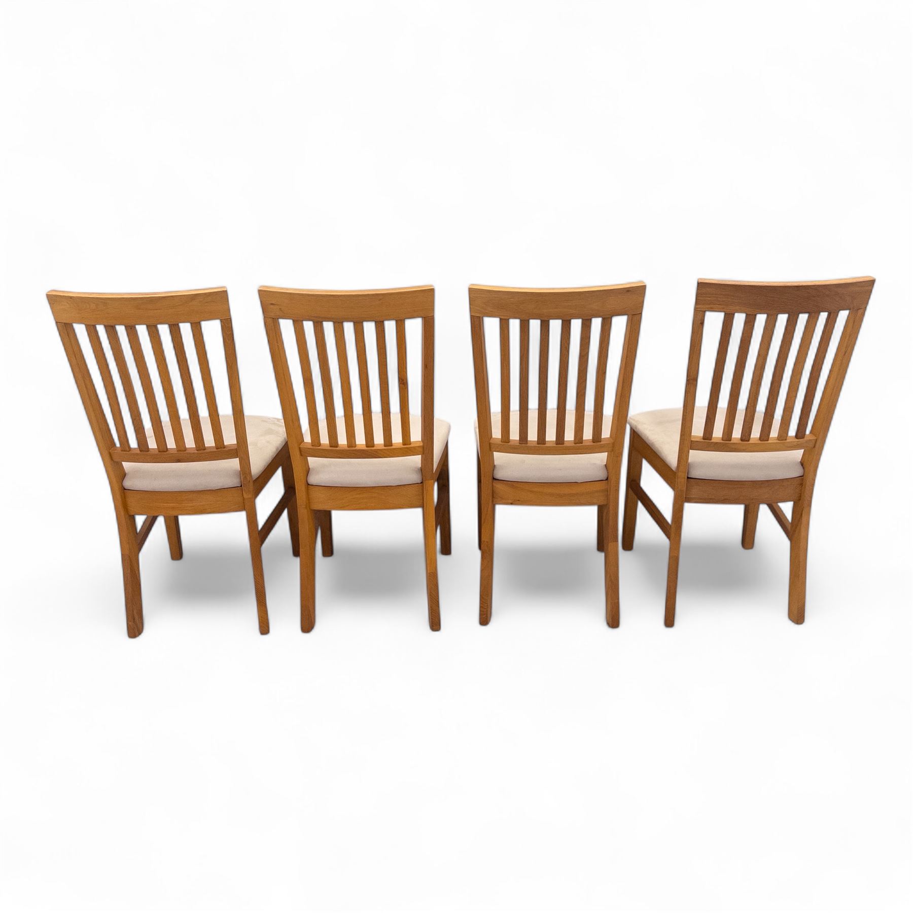 Contemporary solid oak rectangular dining table, with two additional extension leaves, together with eight matching high back dining chairs upholstered in cream suede-effect fabric (9) (Chair H 95cm, W 41cm, D 53cm) (Extends to 270cm)