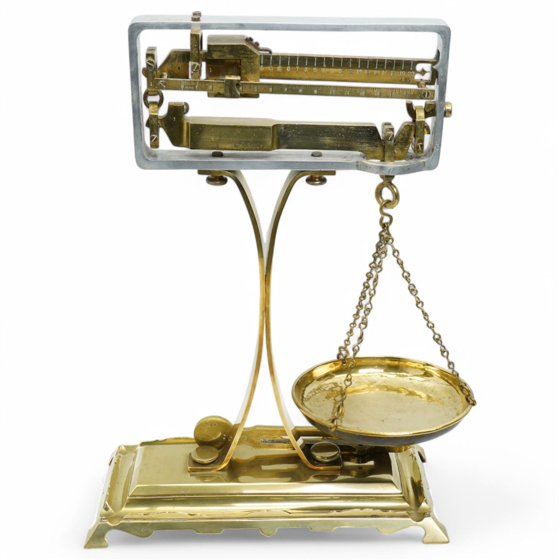 Set of brass balance scales on platform base 