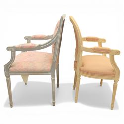 Set of two French design fauteuil armchairs upholstered in pink fabric, one with oval medallion back and padded arms on fluted tapering supports (H 97cm, W 58cm, D 54cm), the other with rectangular padded back, scroll arms and fluted tapering supports (H 99cm, W 60cm, D 60cm)