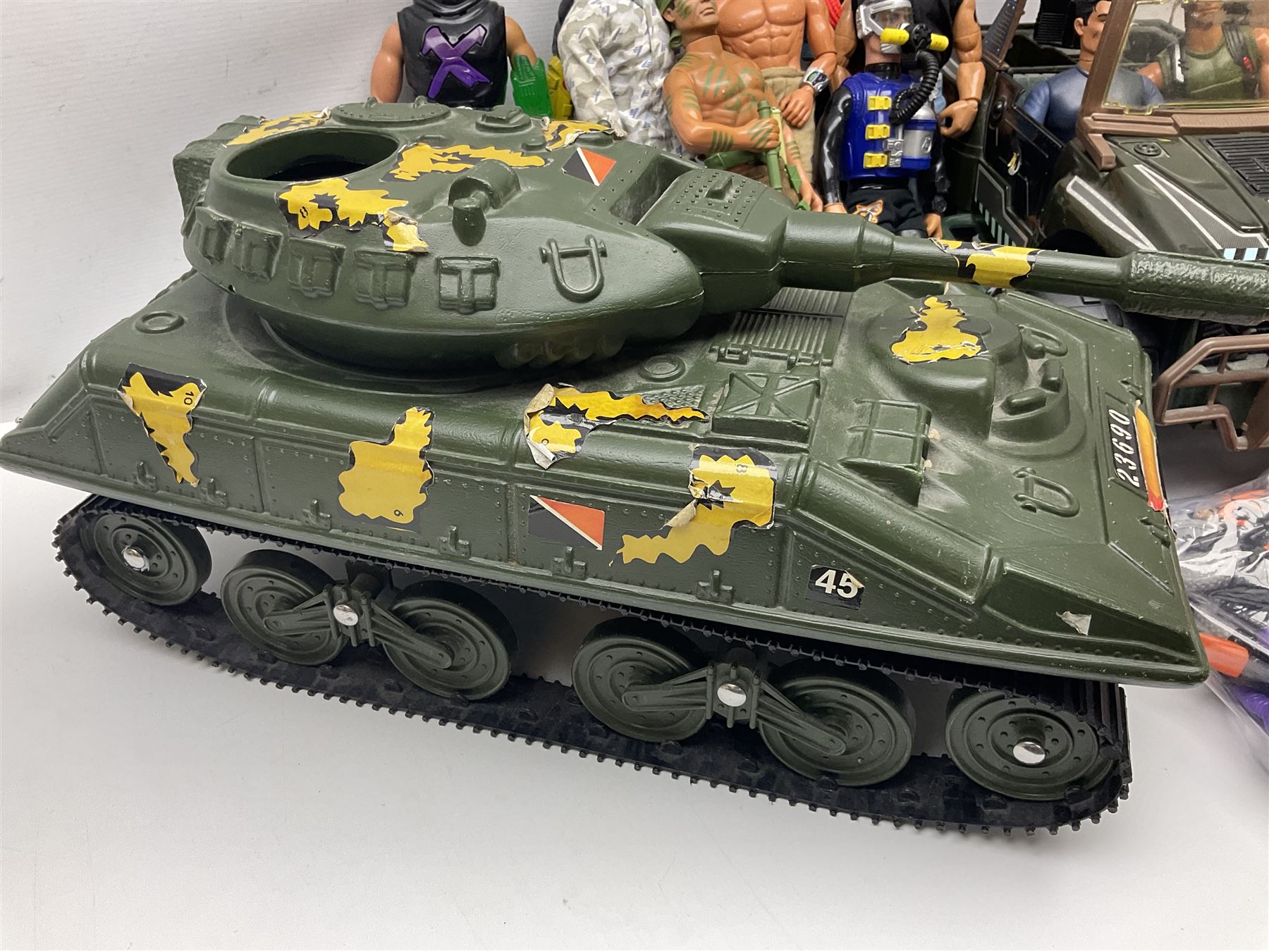 Action Man - Hasbro Strike Force Battle Tank by Sunny Smile; jeep; ten various period dressed figures; and quantity of weapons and other accessories including motorcycle etc
