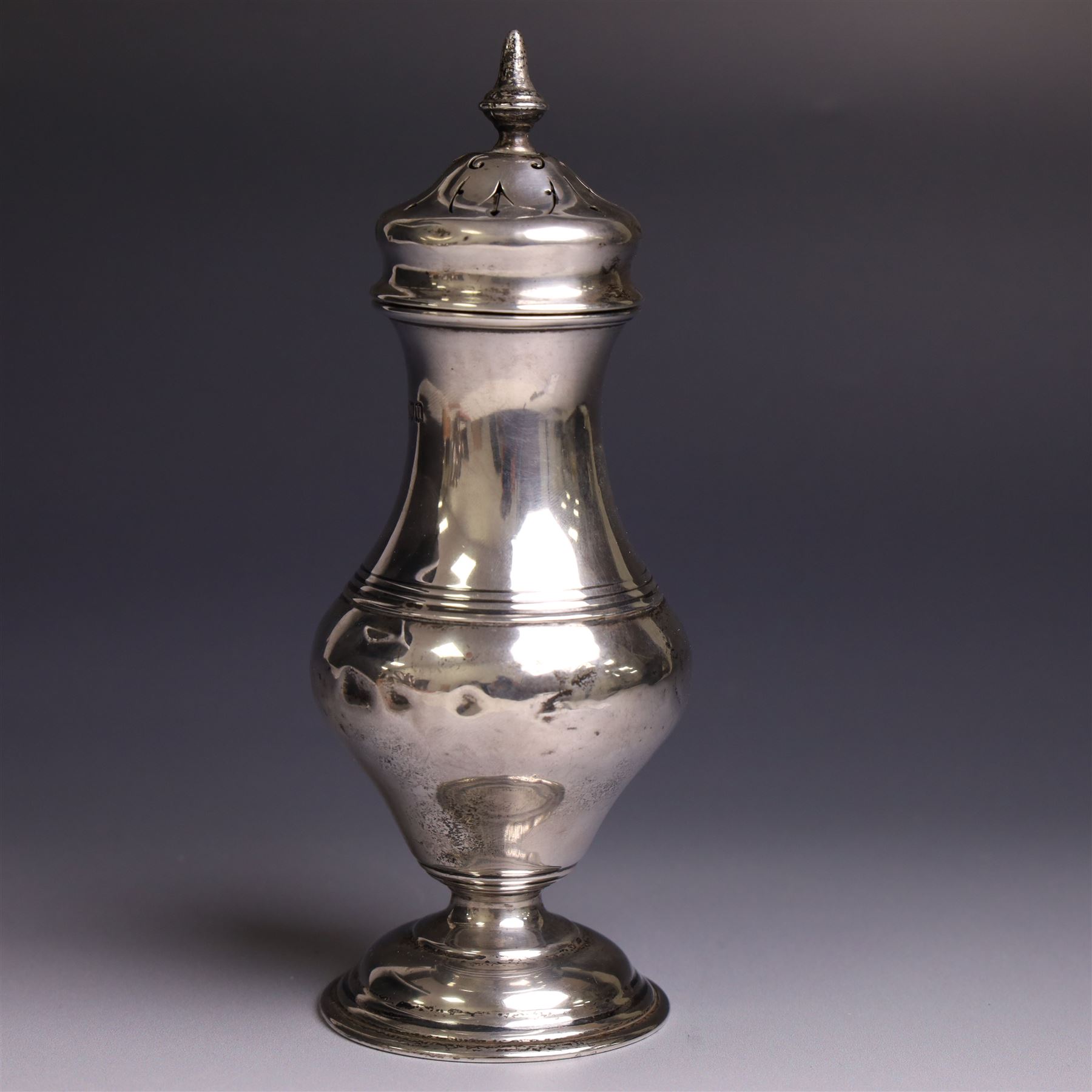 Early 20th century silver sugar caster, of typical form with removable pierced cover and upon circular foot, hallmarked Charles Edwards, London 1916, H18cm