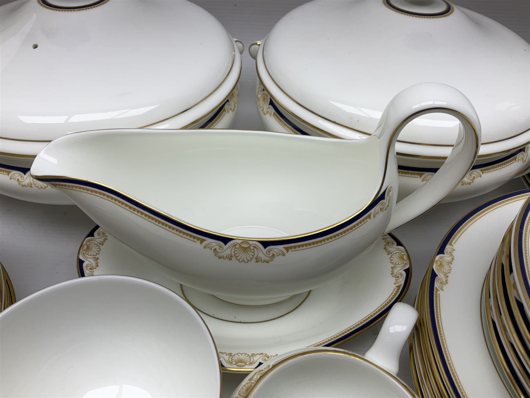 Wedgwood Cavendish pattern dinner service for twelve, comprising dinner plates, side plates, bowls, soup bowls, two tureens, saucer boat and sauce, together with matching part coffee service (82) 