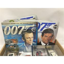 Fabbri James Bond Collection - over one hundred and ten die-cast models in perspex display cases as issued periodically; and a quantity of associated magazines and trading cards, in five boxes
