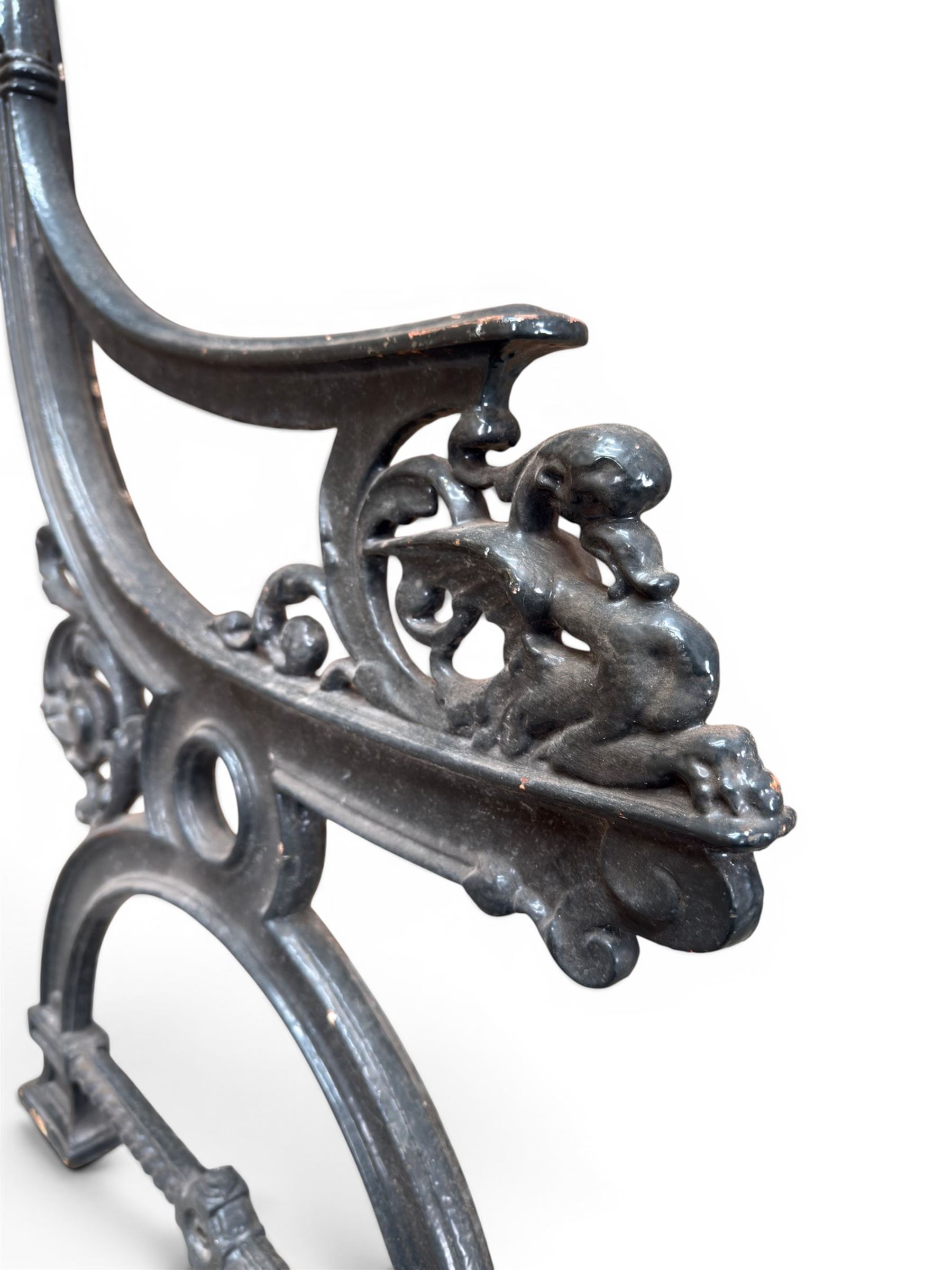 Yates Haywood - pair of 19th century cast iron bench ends, winged griffin detail, arched legs with rope turned decoration, finish in green paint, registration number 206550, first registered 8 March 1867 (see illustration), length as required