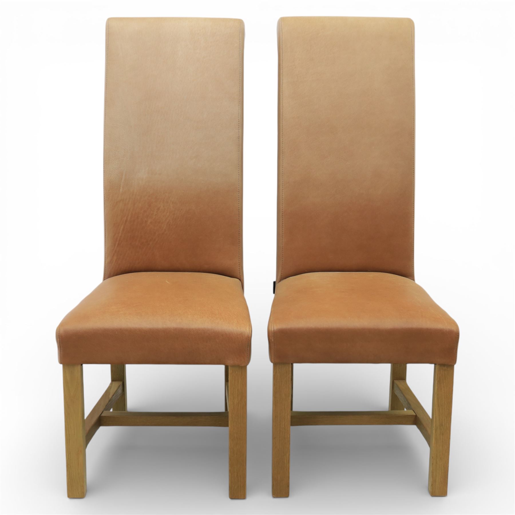 Modern large oak plank top dining table and twelve brown leather high back chairs, table of rustic construction five solid planks with exposed supports, the chairs in brown leather hide with ten standard height and a pair of taller chairs for the foot and head of the table