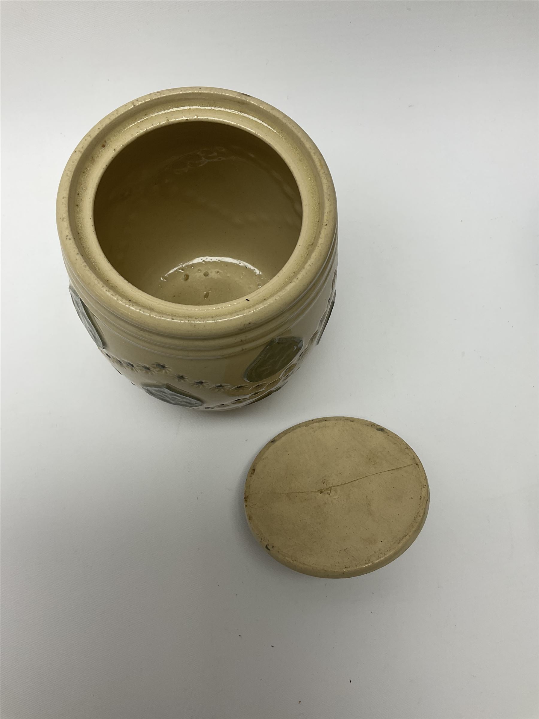 A group of Doulton Lambeth and Royal Doulton tobacco jars, to include examples with relief moulded foliate decoration, each with impressed marks and markers monograms beneath. 