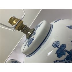 Pair of Chinese table lamps of baluster form, each decorated with landscape scene, raised upon gilt circular base, including shade H63cm