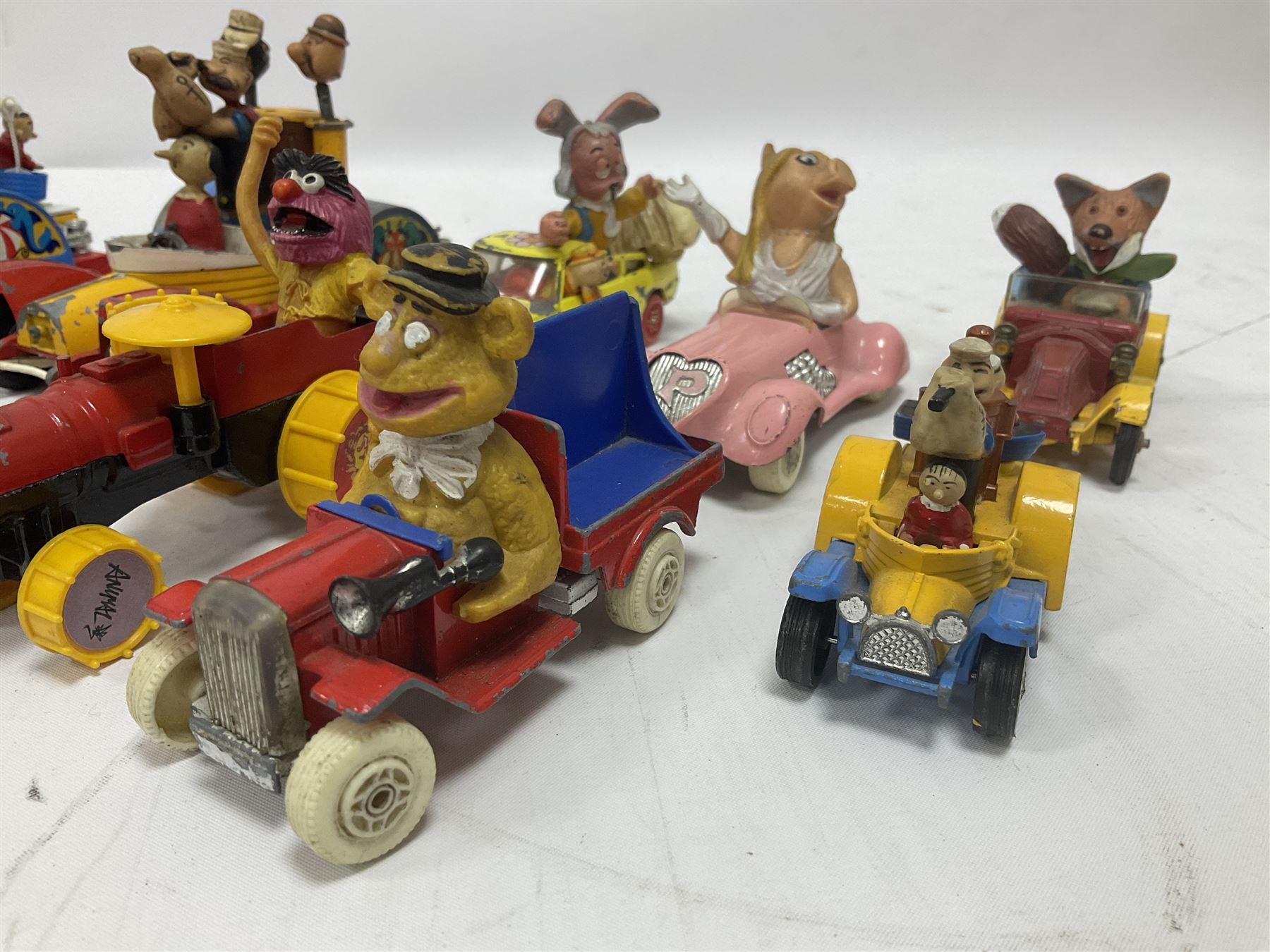 Corgi - ten unboxed and playworn TV/Film related die-cast models including three Popeye Paddle Wagons; Dick Dastardly; Magic Roundabout; Muppets; Batman Penguinmobile; and Basil Brush (10)