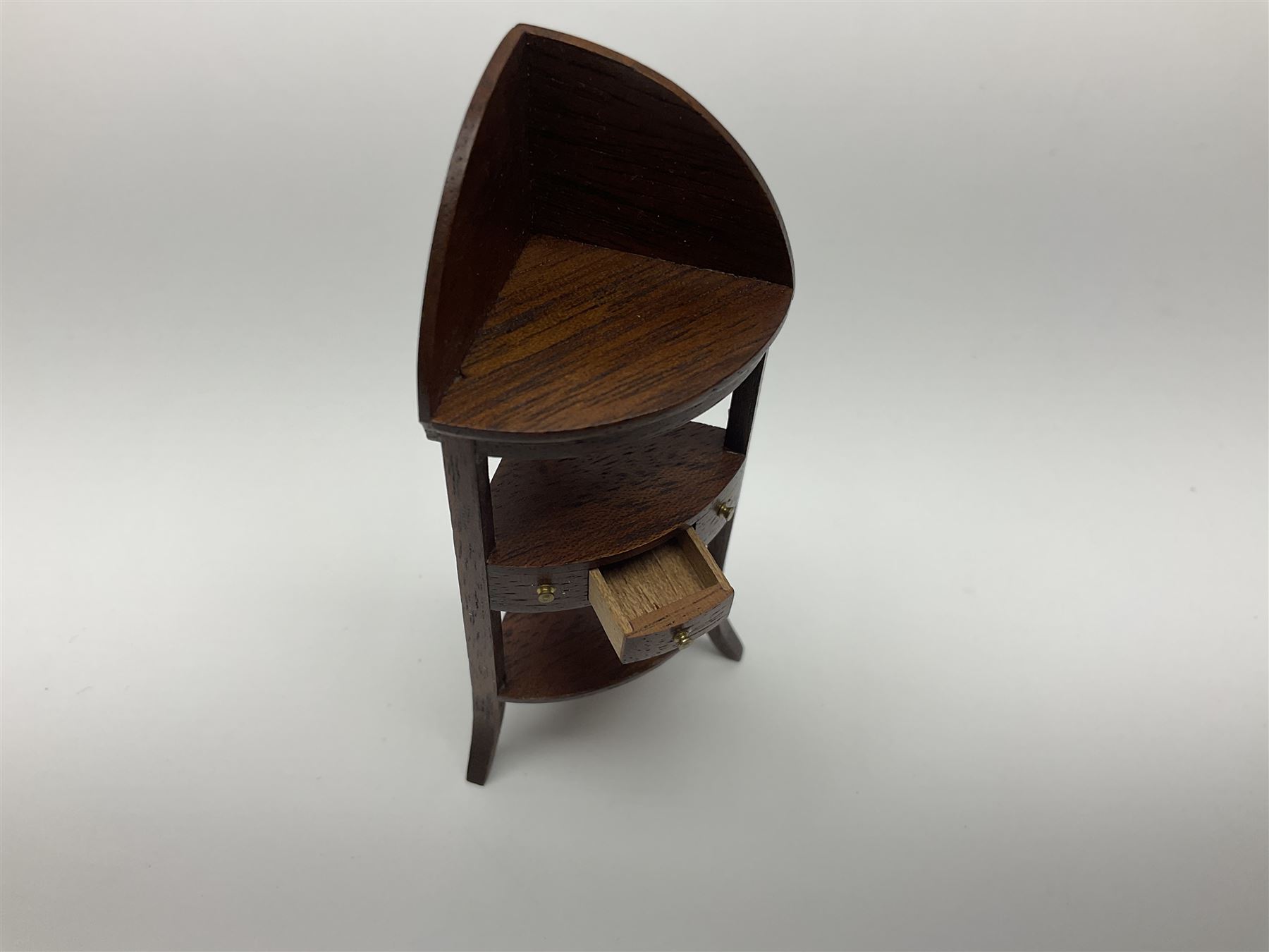 Collection of miniature dolls house furniture and accessories, to include long case clock, chest of drawers, tiled wash stand, ceramics and glass ware, mirror, baskets, etc 