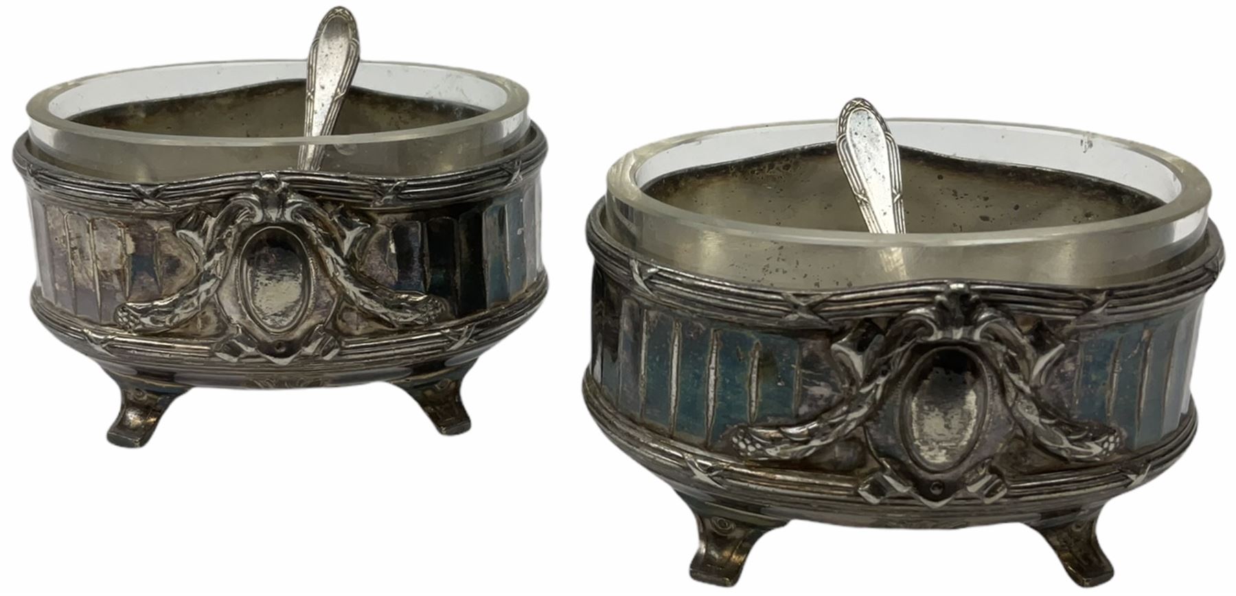 Two Georgian silver toddy ladles with baleen twist handles, (neither hallmarked), one with inset coin to bowl, together with a group of silver plate including cruet stand enclosing two glass bottles with stoppers, shaker and preserve pot with spoon, pair open salts with glass liners, etc. 