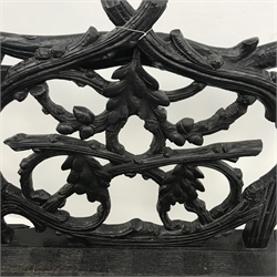  Victorian Black Forest carved bench seat, the branch work pierced back carved with oak leaves and acorns, solid seat with scroll arms and entwined border, S scroll feet joined by bobbin turned stretchers, W154cm, D63cm, H107cm  