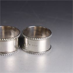 Pair of early 20th century silver napkin rings, plain circular form with oblique gadrooned rim, no engravings, hallmarked William Hutton & Sons Ltd, Sheffield 1912