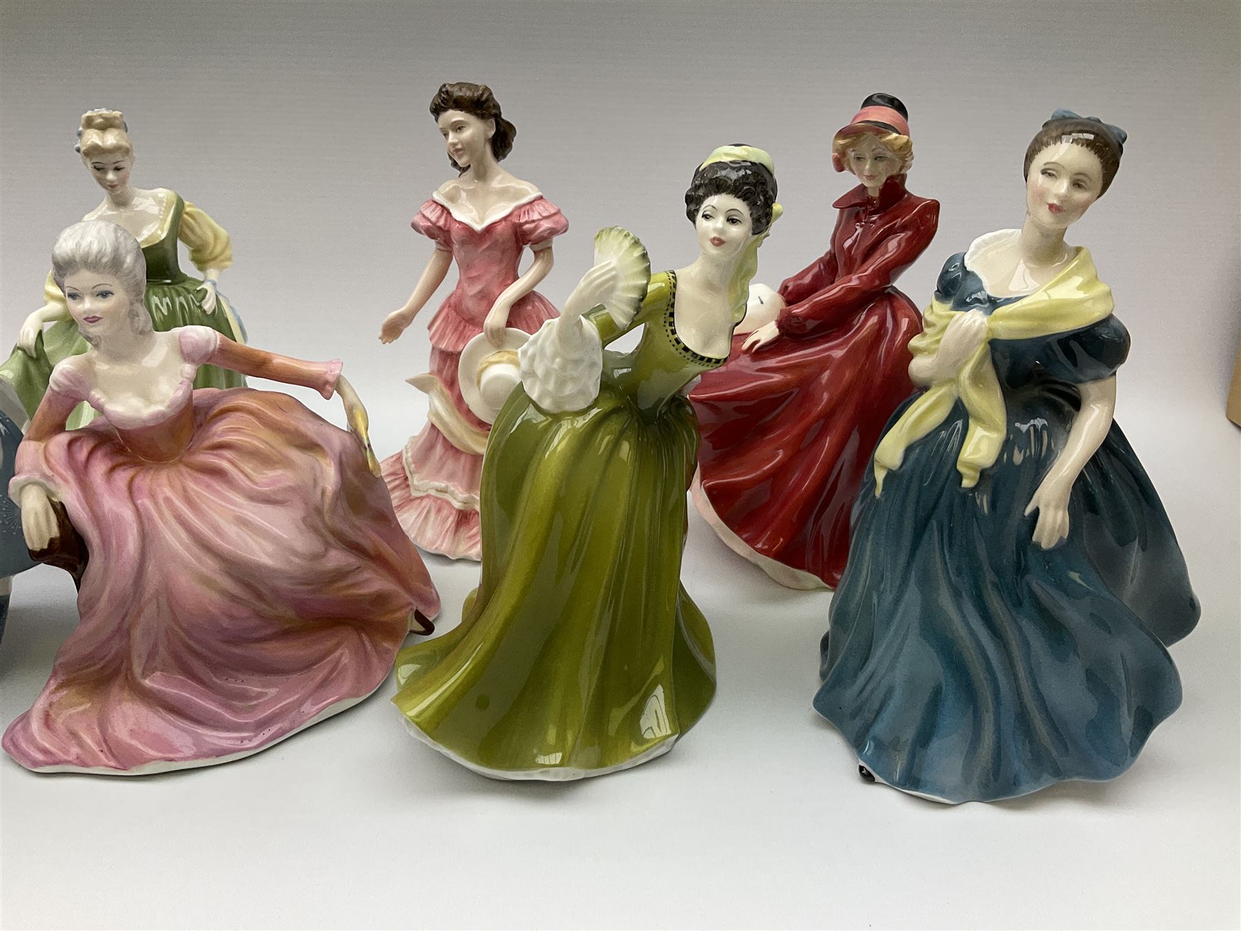 A group of eight Royal Doulton figures, comprising Simone HN2378, Amy HN3854, Fragrance HN2334, Louise HN3207, Adrienne H2304, Michele HN2234, Fine Lady HN2193, Winsome HN2220 and a Coalport figure, Polly. 