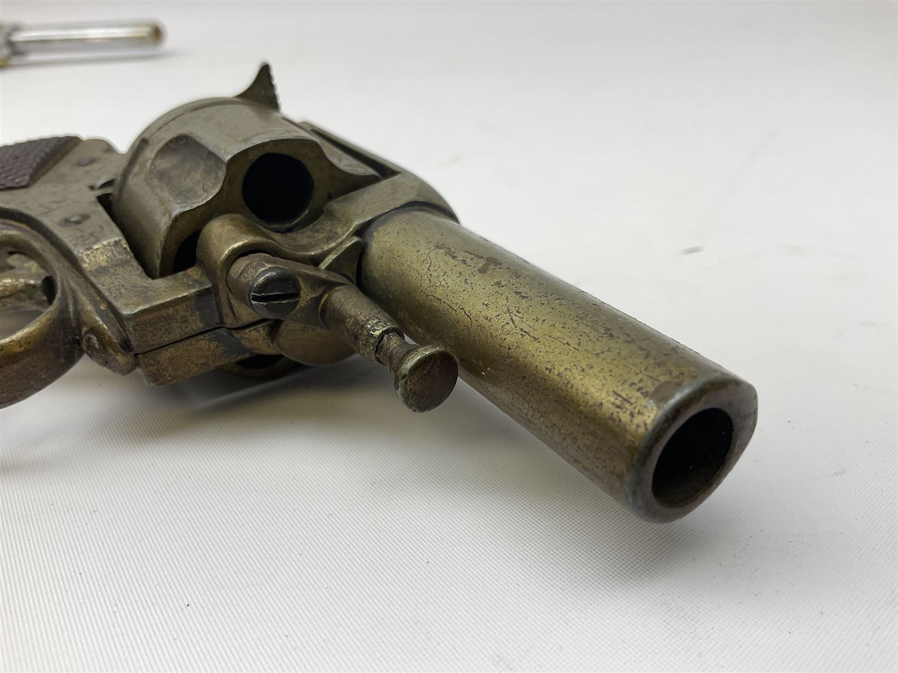 Early 20th century Flobert 5mm blank firing revolver with six-shot chamber, top venting, nickel plated with folding trigger No.118 L12.5cm overall; replica non-firing 'British Bulldog' revolver; and Windproof gas lighter inscribed 'Revolver-99 Spring and Autumn' in holster marked 'Star-Line'