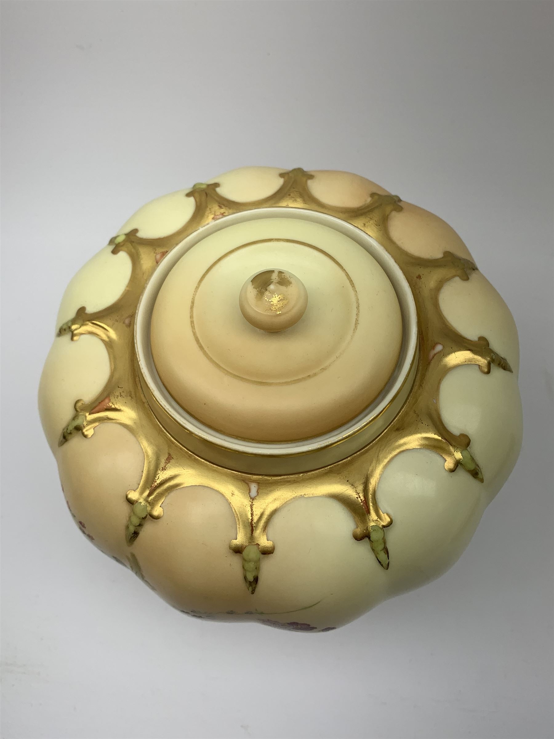 A Royal Worcester blush ivory potpourri jar and cover, of lobed form decorated with floral sprays and heightened with gilt, with printed marks beneath, RdNo112589, shape 1312, overall H19.5cm.