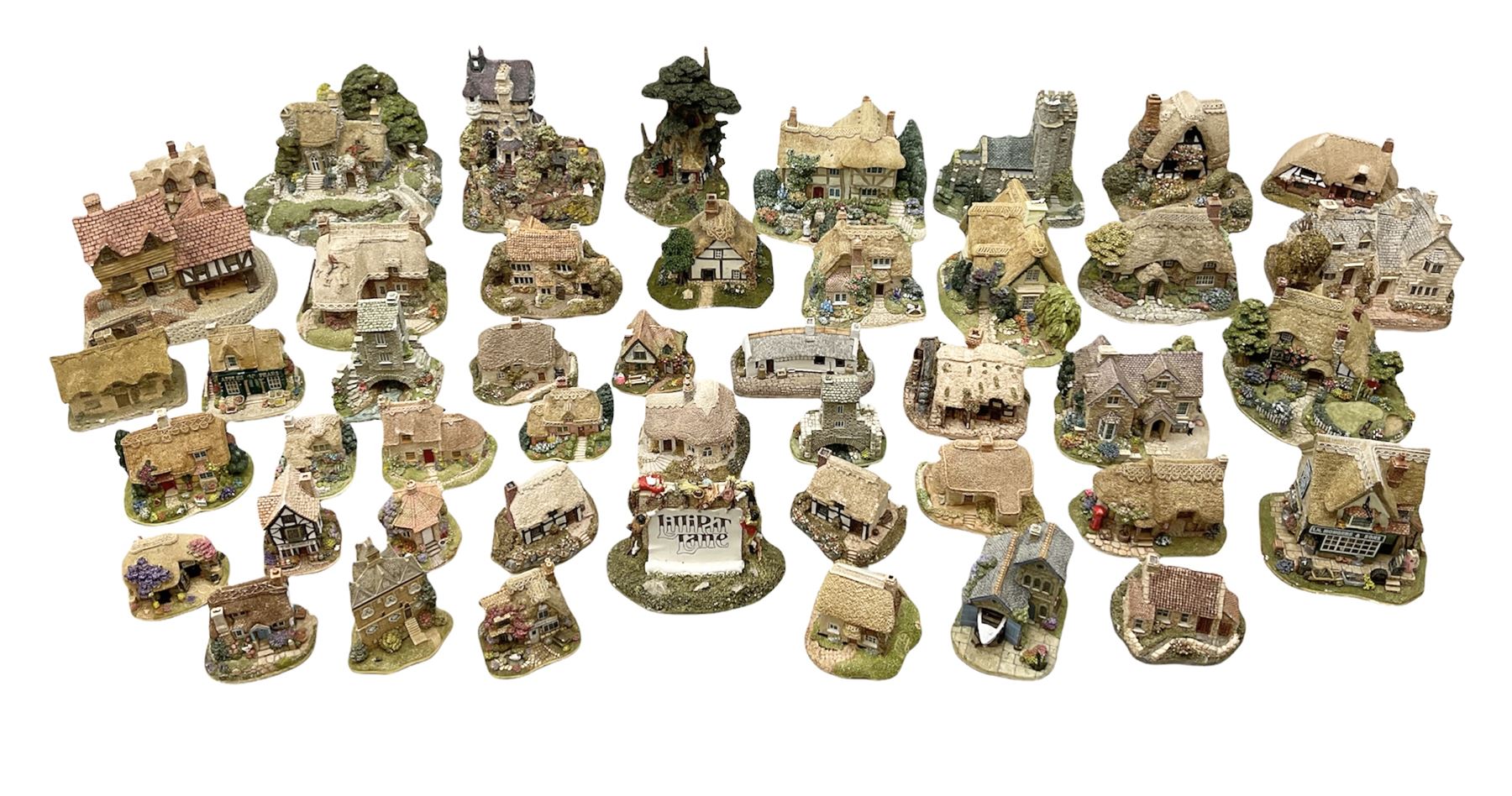 Forty six Lilliput Lane model cottages, to include 'Convent in the Woods', 'Holme Dyke' 'Secret Garden' etc