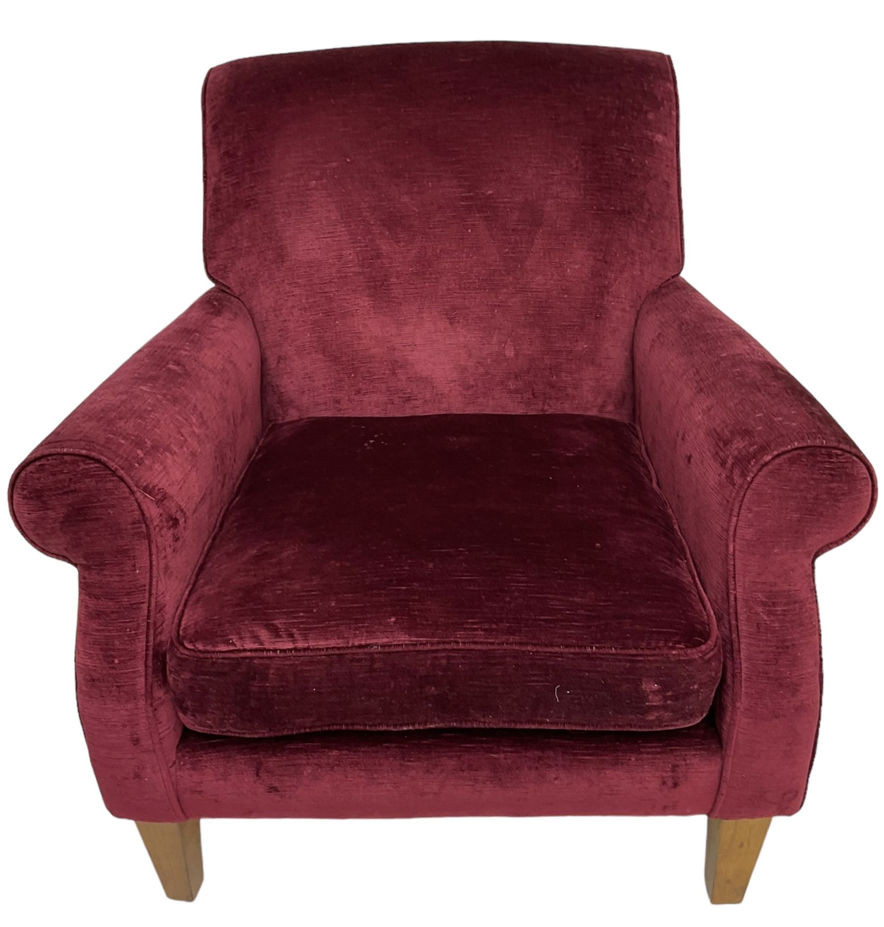 Duresta - traditional shape armchair upholstered in burgundy red velvet, on square tapering front supports (W88cm, H85cm, D103cm); together with a matching rectangular footstool with hinged seat, on turned feet with brass castors (73cm x 54cm, H38cm)