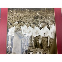 Raich Carter interest - scrap book of a series of articles on his life story for 'Answers' Aug - Oct 1949; scrap book of a proof set of cartoon strips for the Daily Express entitled 'The Raich Carter Story' with accompanying letter dated Dec 1963; photograph of Carter as the only English Schoolboy International to play for two years; photograph of Carter shaking hands with George VI before an England International; two photographs of the '100 years of the FA Cup' match at Wembley; and other paper ephemera. Provenance: By direct descent from the family of Raich Carter having been consigned by his daughter Jane Carter.