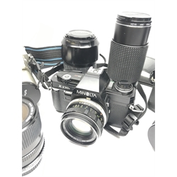 PENTAX program A camera body with RMC Tokina 28mm 1:2.8 lens, RMC Tokina 80-200mm 1:4 lens, RMC Tokina doubler for P/K, Tokina 35-70mm 1:3.5-4.8 lens, OLYMPUS OM 30 camera body with OLYMPUS OM-SYSTEM 50mm 1:1.8 lens, Miranda 28-70mm 1:3.8-4.8 MC macro lens, Makinon MC Zoom1:4.5 80-200mm lens, Minolta X-370s camera body with Minolta MC Rokkor-PF 1:17 lens, two Olympus cameras, Minolta AF Zoom 35-105mm lens, Minolta MAXXUM AF zoom 100-300mm lens, 