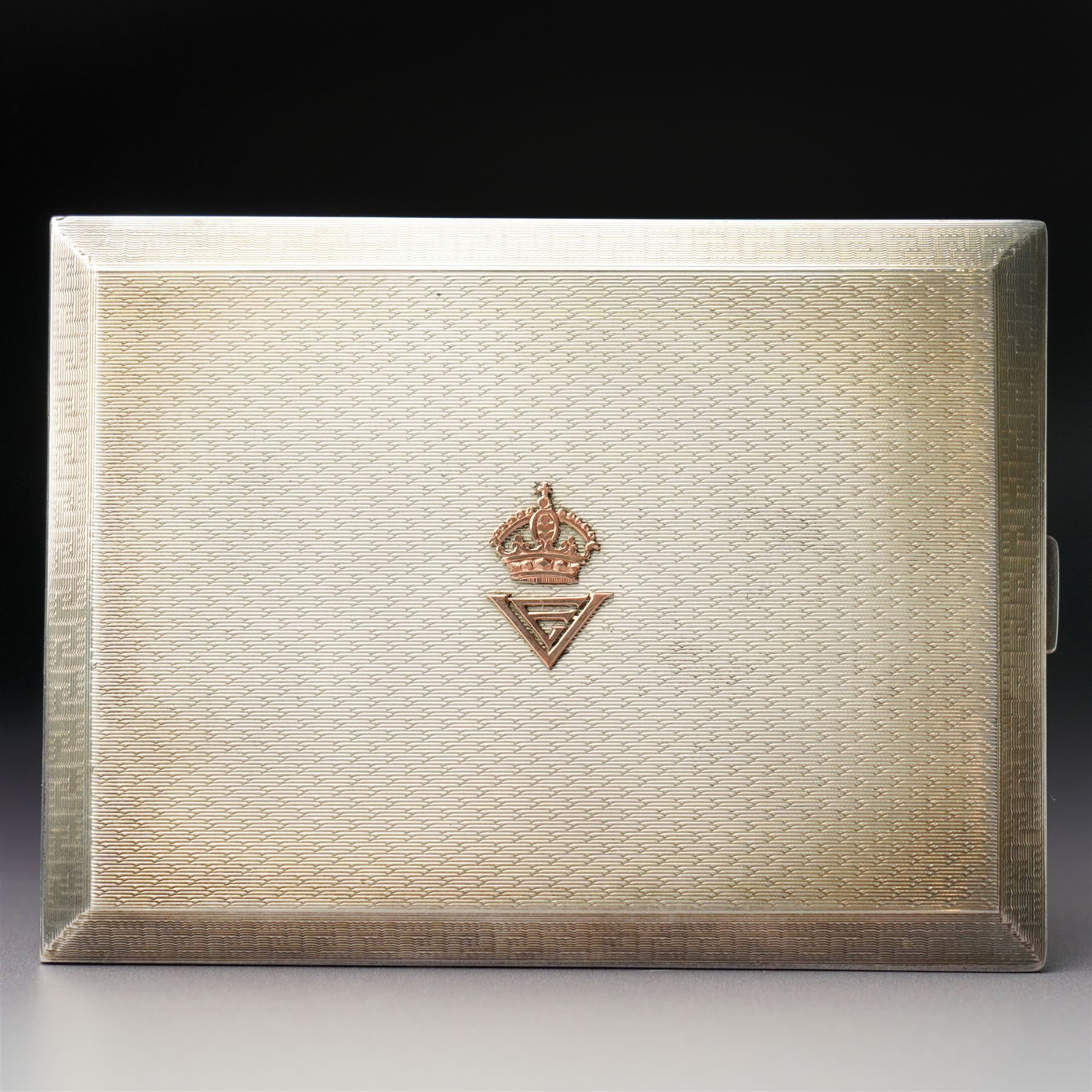 Royalty Interest - Engine turned silver cigarette case with gold crowned cypher, the gilded interior with a greetings card signed 'Edward' and an Egyptian cigarette 11cm x 8cm Birmingham 1925 Maker Adie Bros. Ltd in the original gilt tooled leather case marked 'Hartley, 45 Albemarle St., London'