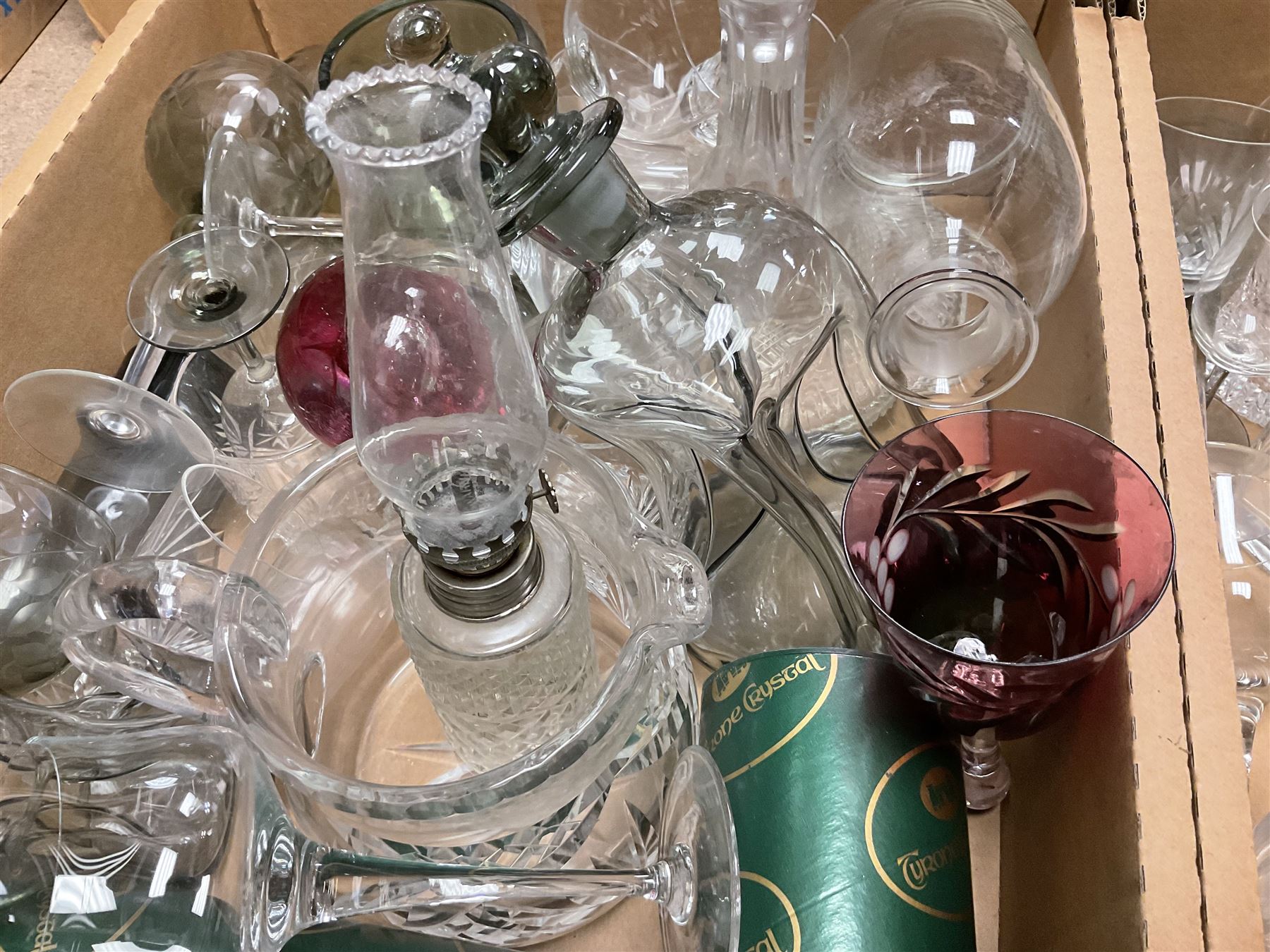 Caithness 'Fireball' paperweight, together with four cased Tyrone Crystal glasses, glass oil lamp, three glass decanters etc, in two boxes